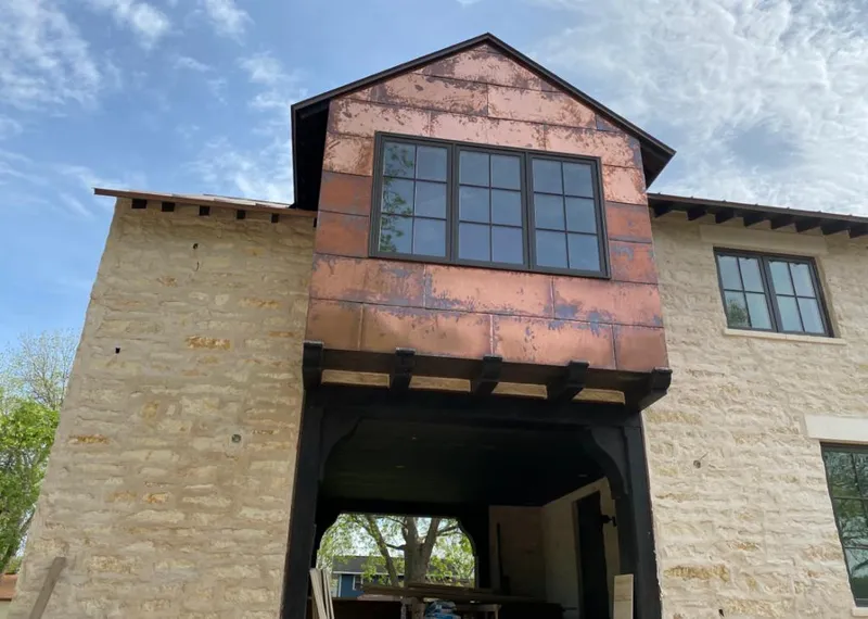 Copper metal panel facade on a stone building for Metal Roof Coating in Willow Park