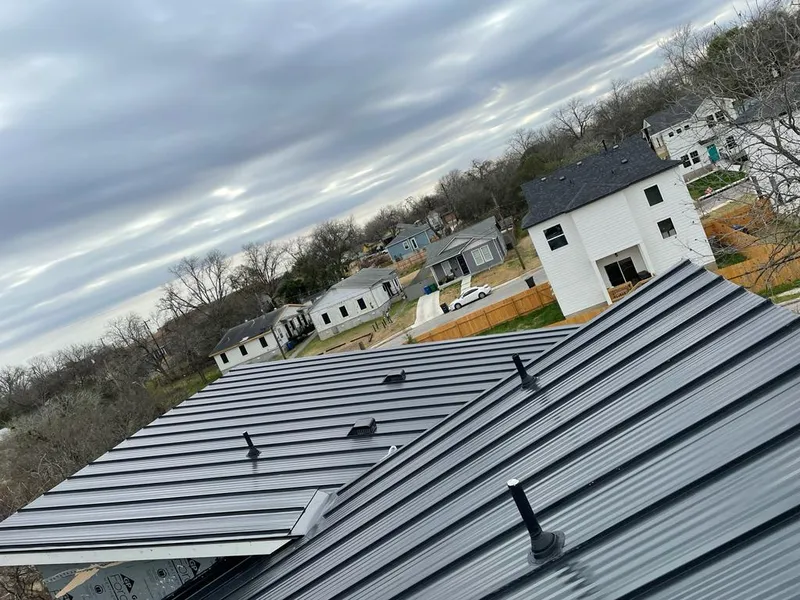 Standing seam metal roof panels with vents for Skylight Repair in Willow Park